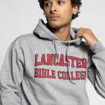 man wearing a gray hoodie with 'Lancaster Bible College' text on a light gray background